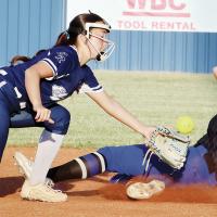 Zoey Pawnee had a pickoff throw bounce over her glove as she reaches out to make a tag