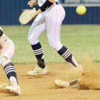 Maddie Fox reaches out to snag a pickoff throw