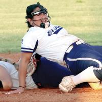 Taylor Acosta leans back on her tiptoes to tag out an OKC Broncos base runner