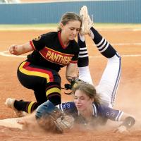 Hallie Ferguson collides with a Putnam City North infielder on a pickoff play at third base