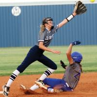 Iliana Ashford stretches out in an attempt to grab a high pickoff throw