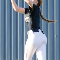 Maddie Moss runs under a fly ball