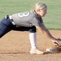 Jacy Little reaches out to make a tag on a Santa Fe South base runner
