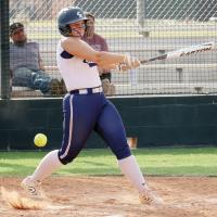 Lexi Porter hits the ball hard off the dirt for a foul