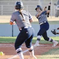 Chenoa White hits the ball with Bailey Brothers on base