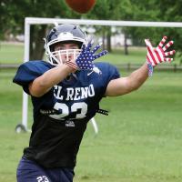 Deacon Martin reaches out to grab a pass