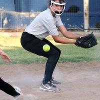A pickoff throw bounces off the glove of Addison Lager