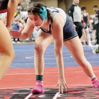 Seely Chronister looks for an open shot during her state quarterfinals match with Tulsa Union’s Corey Harris