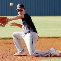 Gabe Compton makes a backhand stab at a wide throw to second base