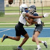 Evan Roman Nose takes a helmet to the face from a Guthrie defender