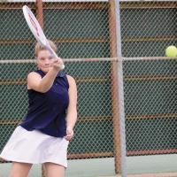 Serenity Billings keeps a close eye on the ball during a forehand return shot