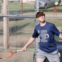 Jim Rinehart steps into a forehand return shot