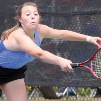 Riley Connor stretches out to try and reach a serve