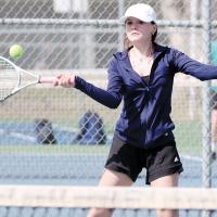 Bri Barksdale sets up to hit a forehand return shot