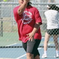 Jacob Richey watches a forehand return shot fly over the net