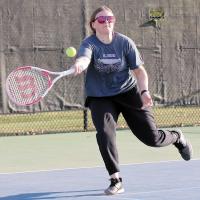 MaeKenna Wyrick reaches out to hit a forehand return shot