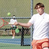 Jim Rinehart steps into a forehand return shot