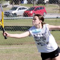 Brianna Barksdale stretches out to hit a forehand return shot