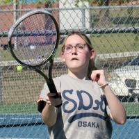 Carlotta Monje hits a forehand return shot