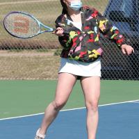 Riley Connor sets up for a return shot in her doubles match