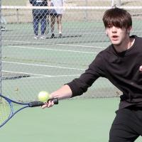 Xiven Wallin hits a forehand return shot