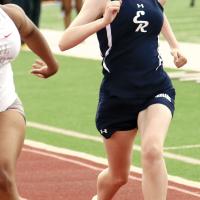 Madeline Taylor tries to catch a Carl Albert runner