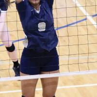 Kadin Patterson jumps at the net on a block attempt