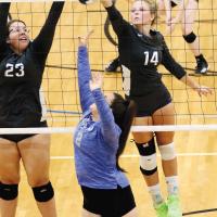 Savannah Robinson and Bailey Denwalt team up for a double block attempt