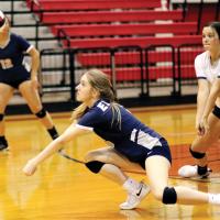EHS volleyball_Chandler digs up serve