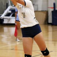 Riley Connor digs up the ball