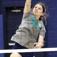 Bri Barksdale hits a shot over the net