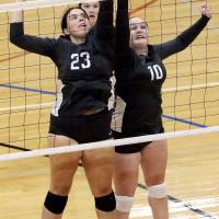 Savannah Robinson reaches over Emma Patswald to block a shot attempt