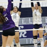 Meredick Martinez (11) and Brantlie Charmasson (8) set up for a double block attempt