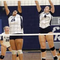 Trinity Black and Jewell Graham attempt a double block