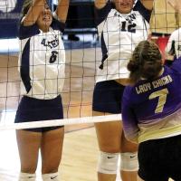Kallie Mayfield and Anessa Woods attempt a double block