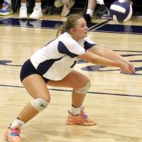 Emercyn Looper digs up a ball on defense