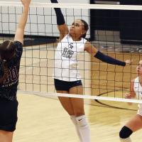 Mary Gonzalez tries to tip a shot at the net