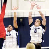 Trinity Black and Jewell Graham (6) attempt a block