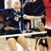 Lily Elliott hits a shot over the net