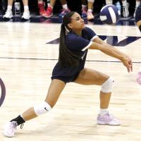 Mary Gonzalez digs up a shot along the back row