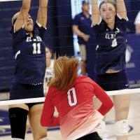 Meredick Martinez and Brantlie Charmasson attempt a double block