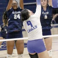 Michaela Reed and Brantlie Charmasson combine for a double block attempt