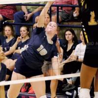Emma Patswald (10) tries to hit around a Lawton MacArthur blocker