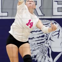 Radley Miller serves during the game with Noble