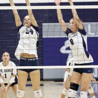 Sisters Quinn (24) and Brantlie (8) Charmasson attempt a double block