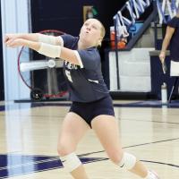 Radley Miller with a dig during a home match