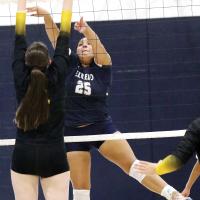 Trinity Black tips a shot over the top of a Tecumseh defender