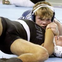 Will Heger uses his chin to press the shoulder of Elgin’s Diego Ortiz