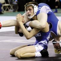 EHS wrestling_Knapp grabs the legs of Clarke 