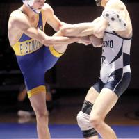 Niko Gonzalez attempts to lock in a single-leg takedown of Piedmont’s Brody Heusel
